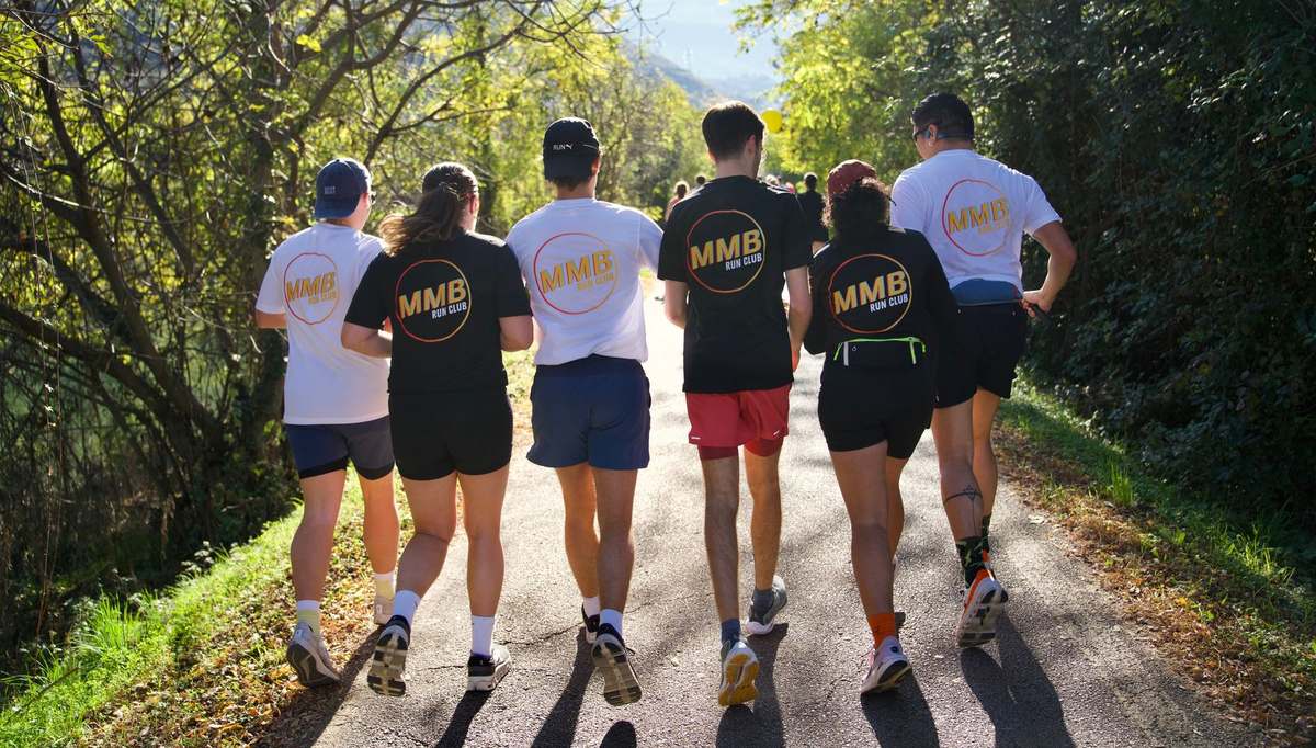The Mood Booster Run Club group walking together wearing MMB run club t-shirts